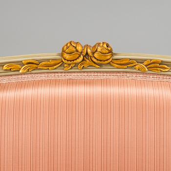 A late 20th century rococo-style sofa.