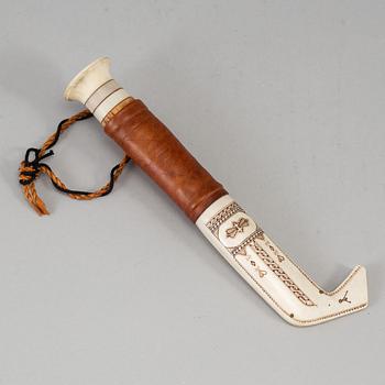 A Sami reindeer horn knife, unidentified signature.