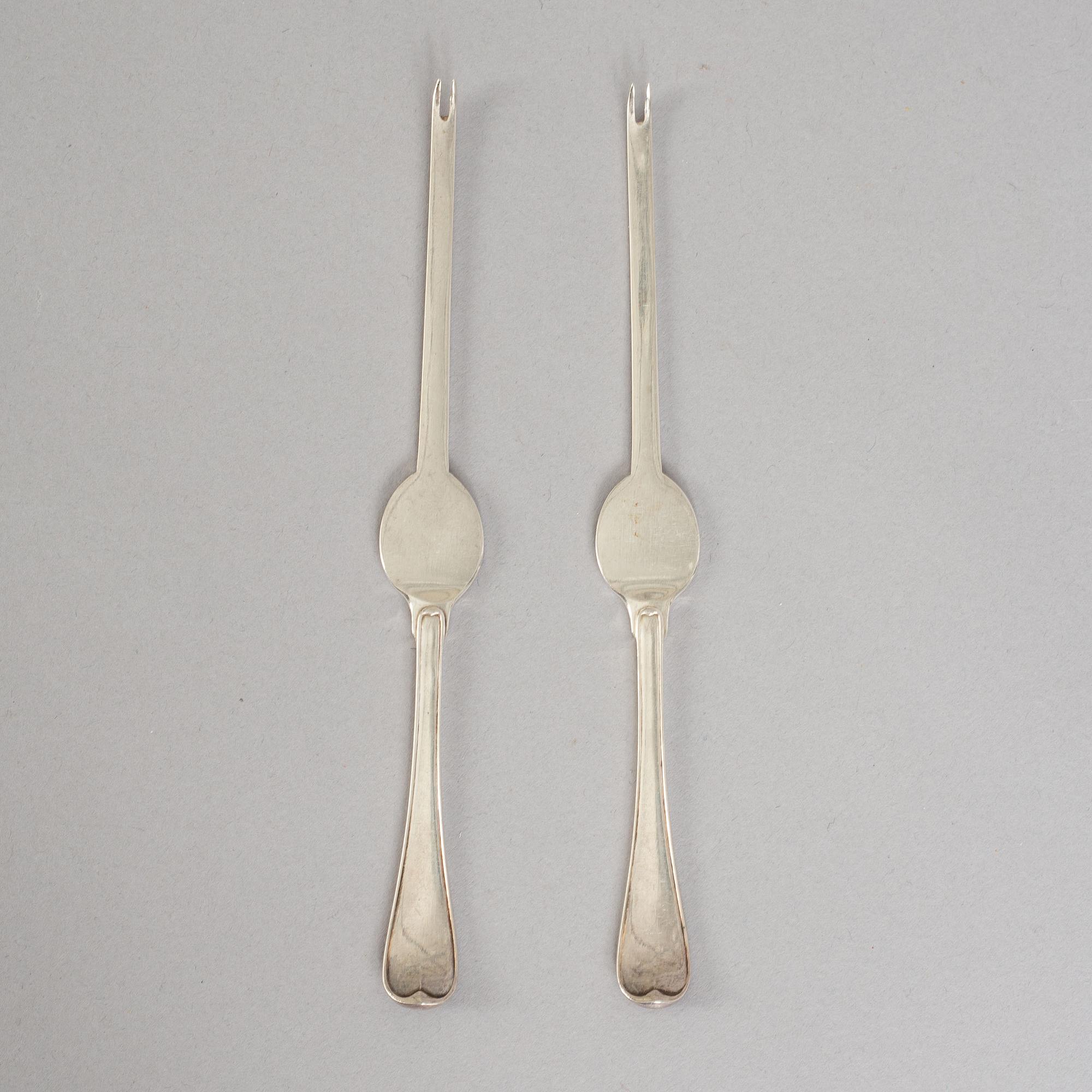 A set of ten French 19th century silver lobster-cutery.
