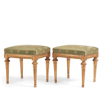 92. A pair of Gustavian giltwood stools by E. Ståhl (master in Stockholm 1794-1820).