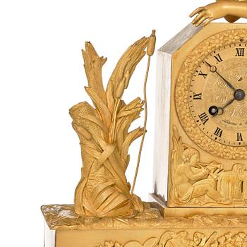 A French Empire ormolu and patinated bronze mantel clock, Paris, early 19th century.