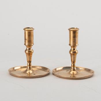 A pair of Swedish brass 18th century candlesticks.