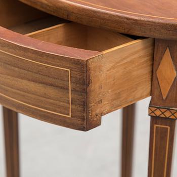 An early 19th century mahogany veneered table.