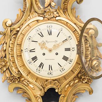 A rococo style wall clock, first half of the 20th century.