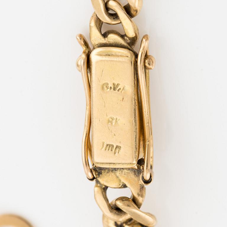 Armband, 18K guld, med tre berlocker.