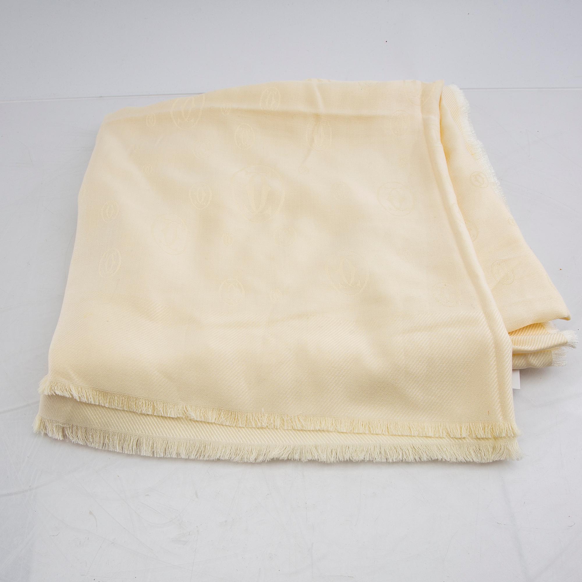 Cartier, a wool/silk scarf.