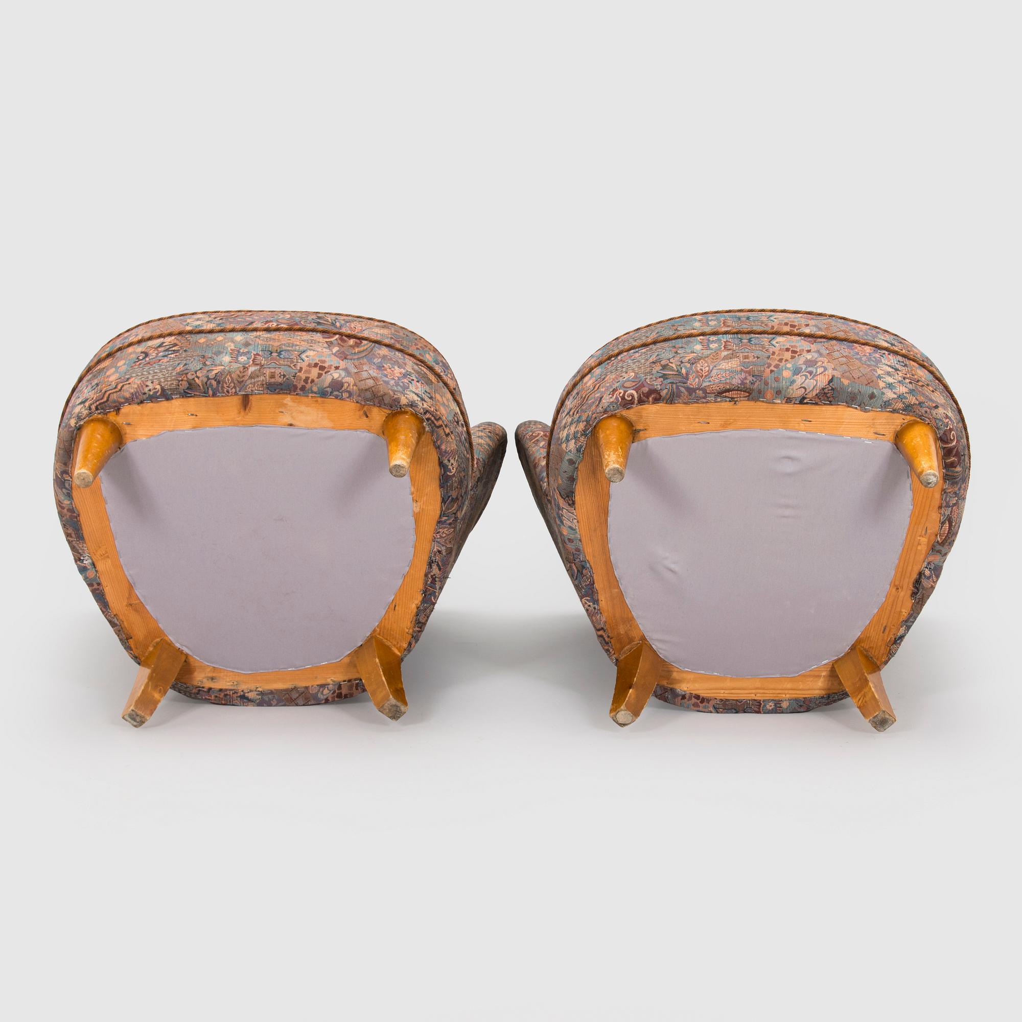 A pair of mid-20th century armchairs.