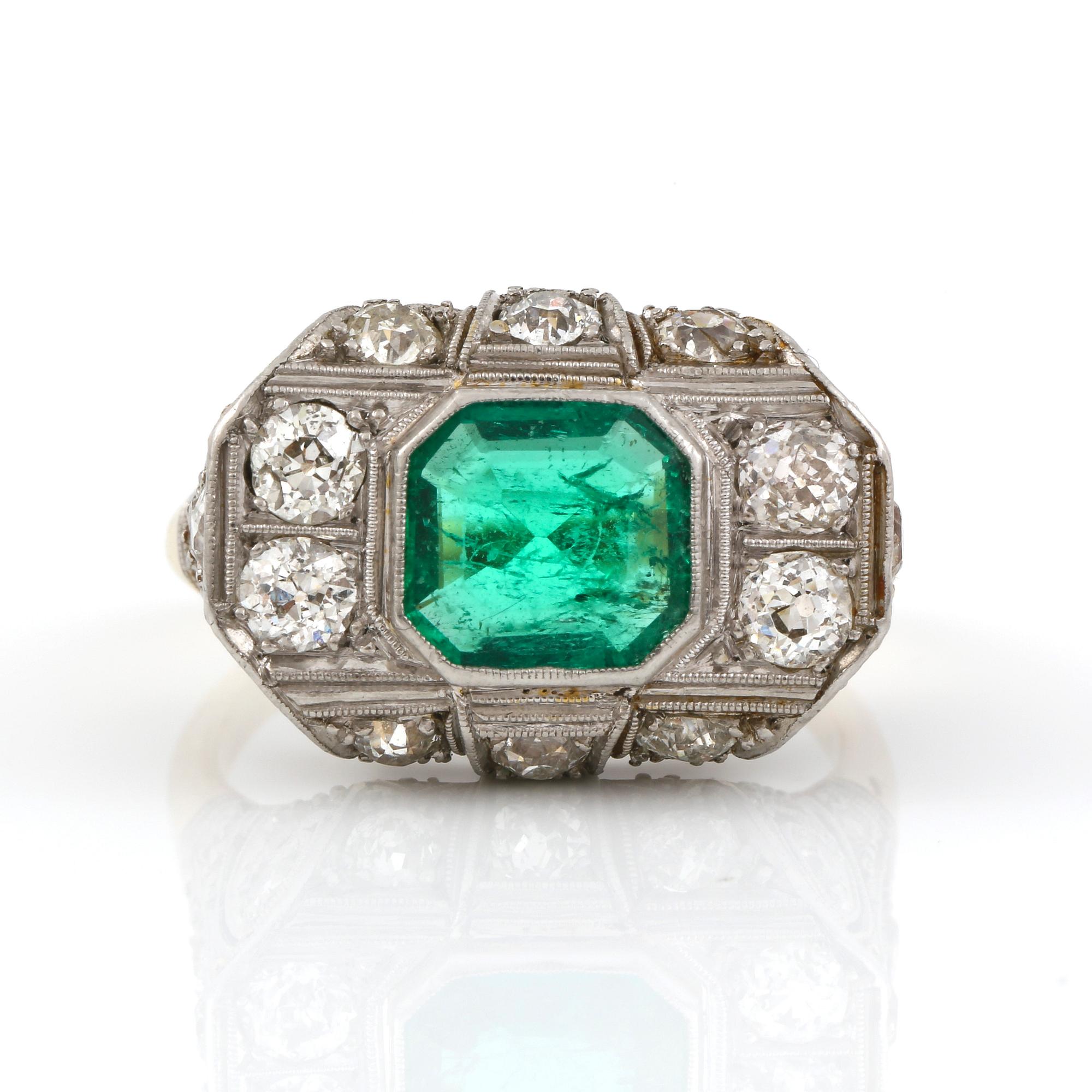 An Art deco, circa 0.70 ct, emerald and 1.00 ct old-cut diamond ring.