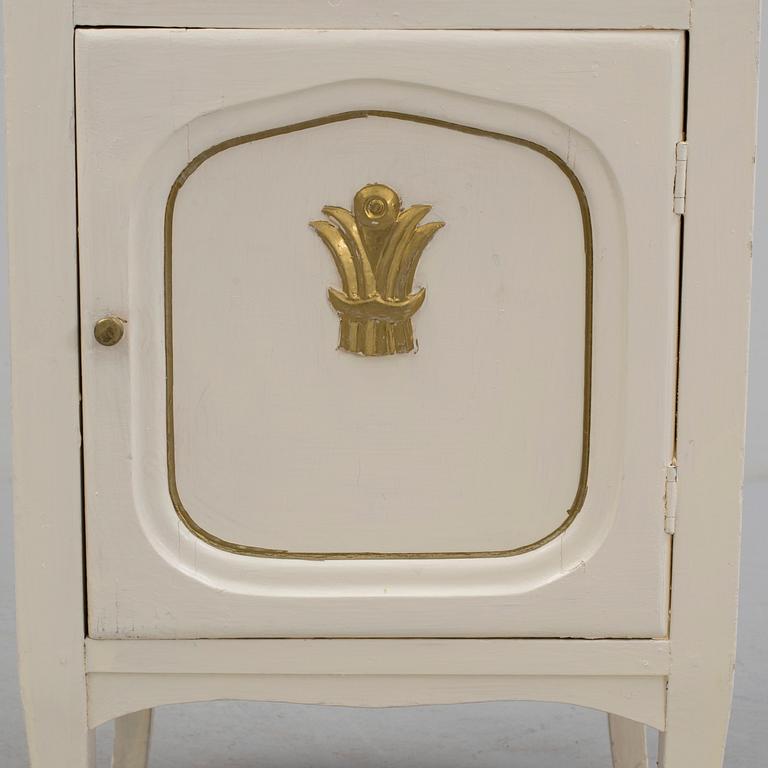 A early bedside table with marble top.