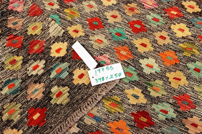 A Kilim carpet, c. 348 x 258 cm.