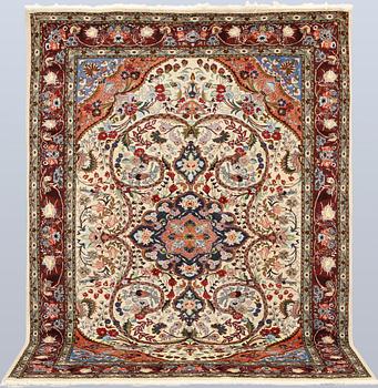 A part silk Tabriz rug, so-called 50 Raj, approx. 242 x 178 cm.