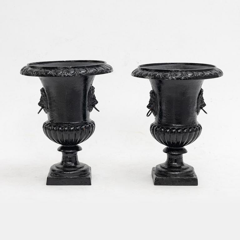 Garden urns, a pair, cast iron, 20th century.