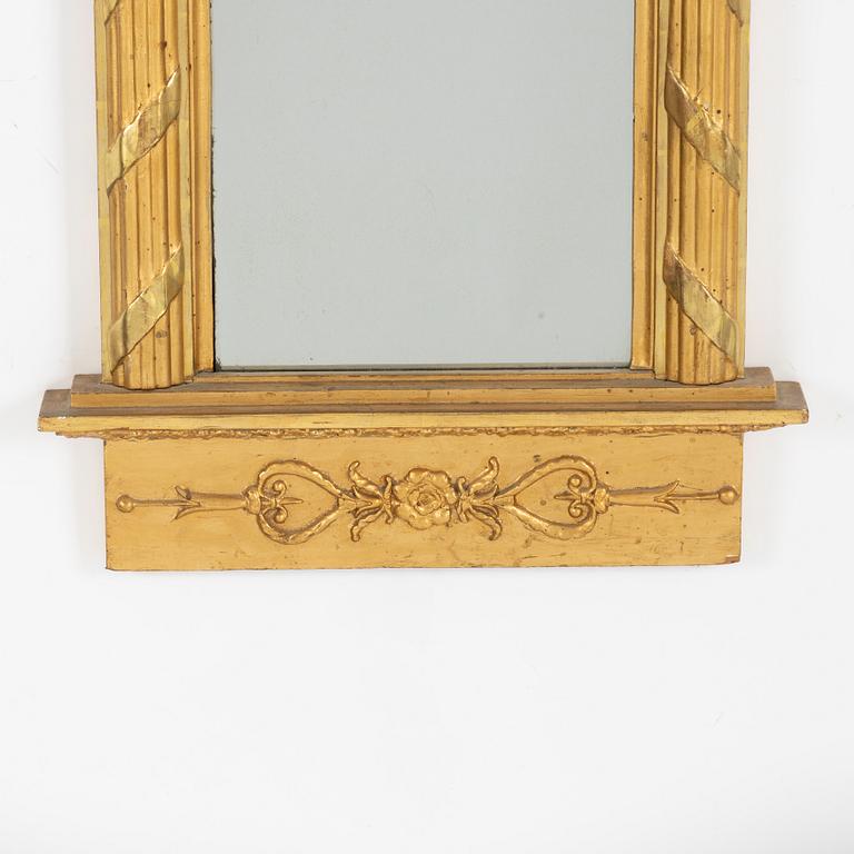 A giltwood Empire mirror by J. P. Holmberg (active in Stockholm 1813 - 1831).