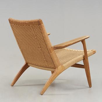 A Hans J Wegner 'CH-25' oak easy chair, Carl Hansen & Son, Denmark.