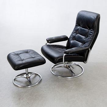 A leather swivel armchair and stool, Söderbergs  1980s.