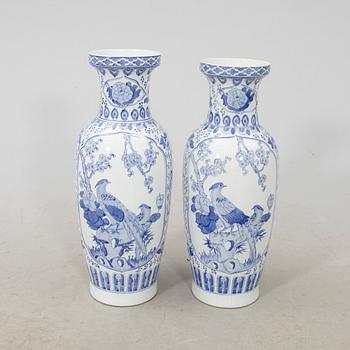 A pair of porcelain 21st century floor vases.