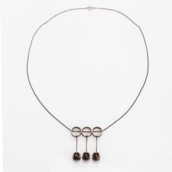 Elis Kauppi, A silver necklace with tiger's eye pearls. Kupittaan kulta, Turku 1965.