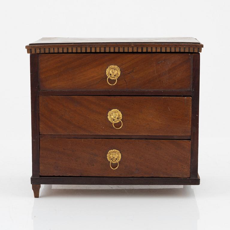 An Empire mahogany miniature commode, 19th Century.