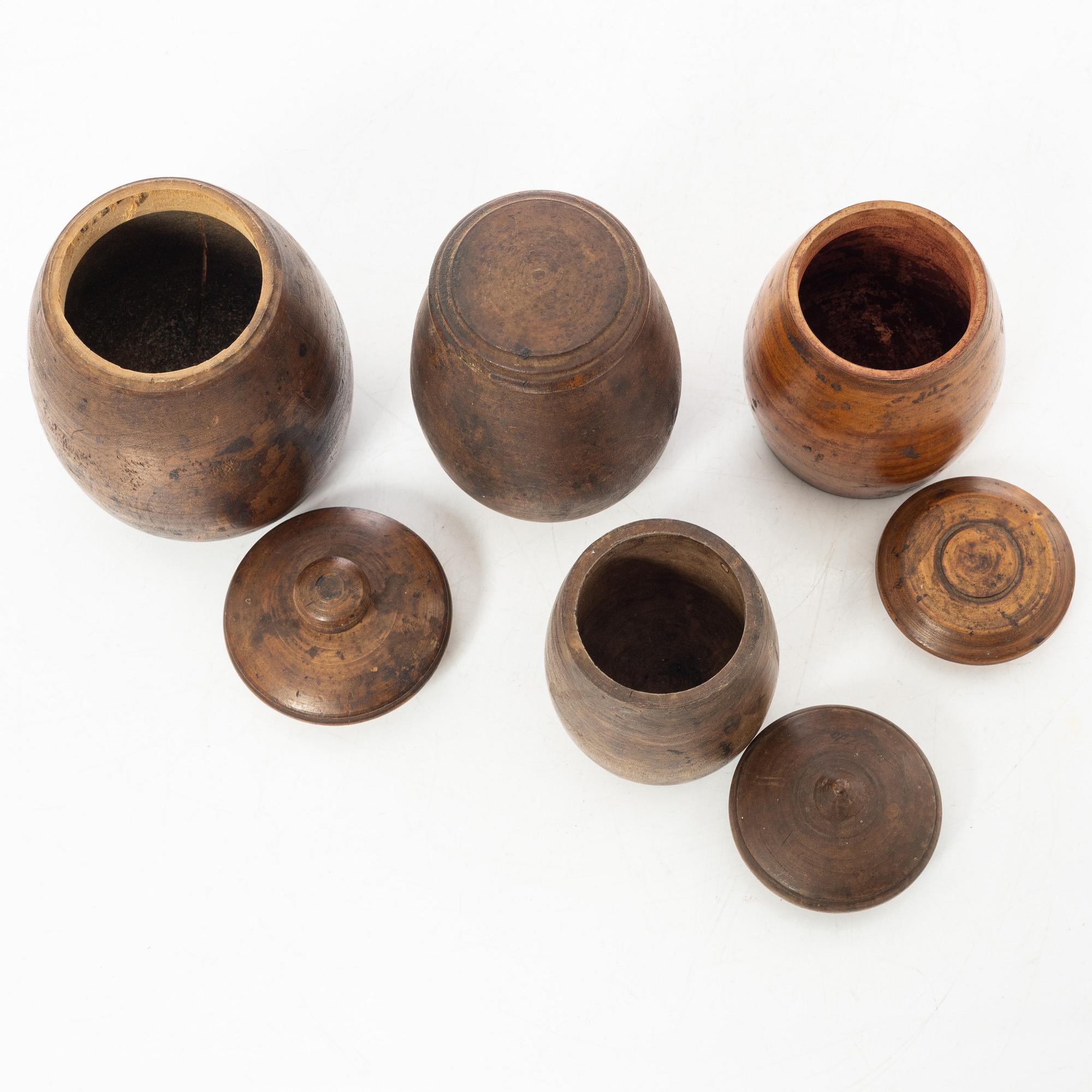 A set of four turned folk art jars, 19th century.