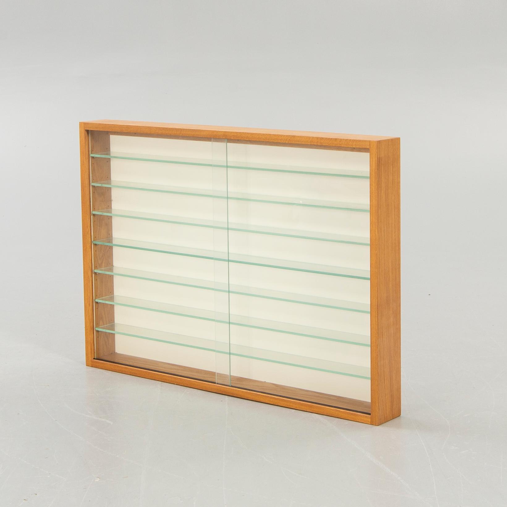 Glass display cabinet, second half of the 20th century.