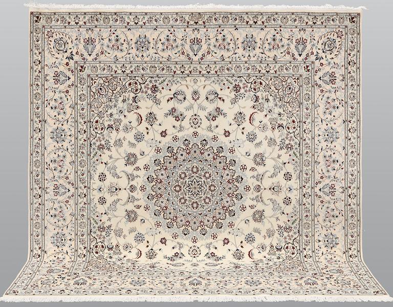 A Nain part silk carpet, c. 207 x 208 cm.