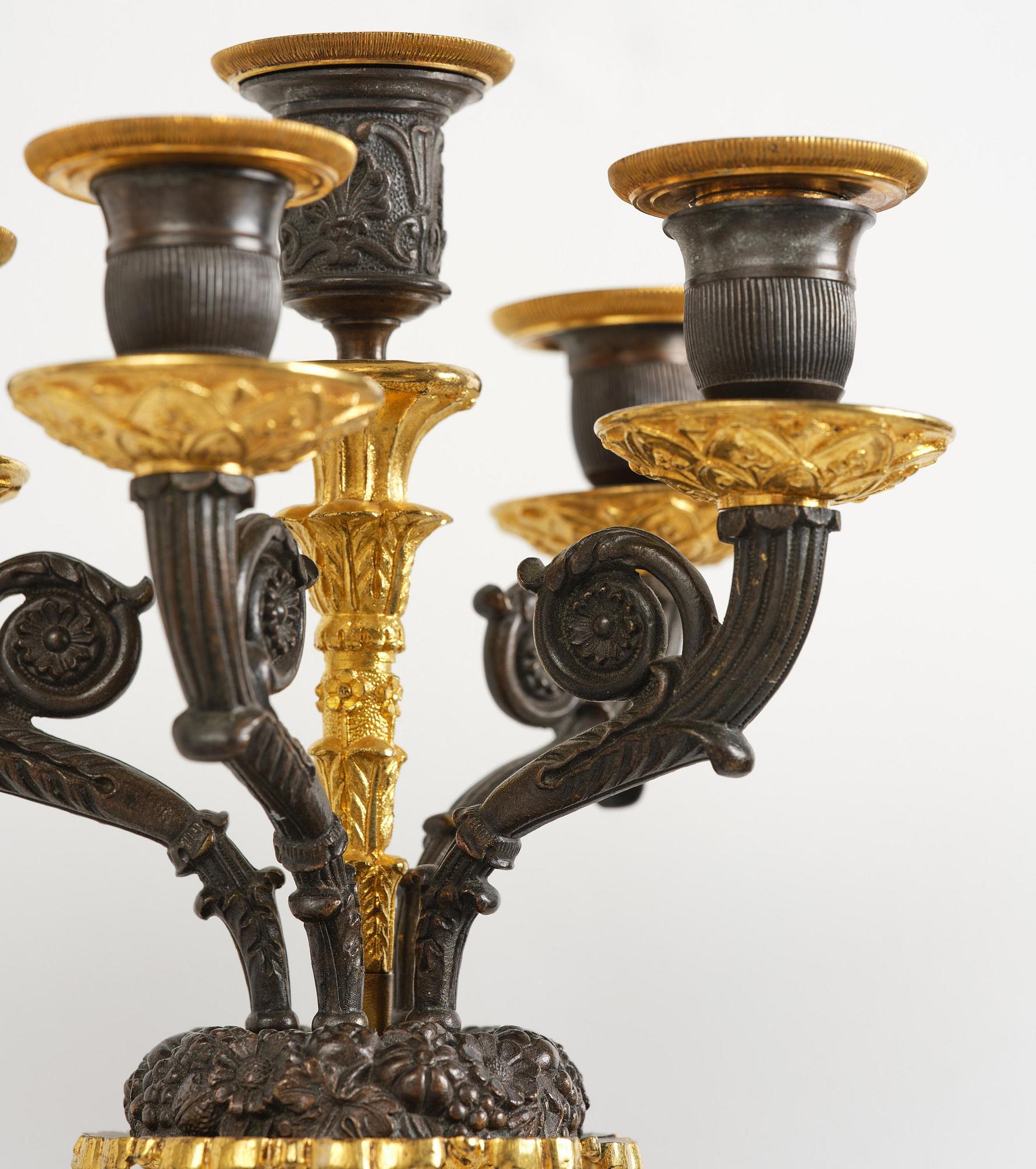 A pair of French Empire five-branch gilt and patinated bronze appliques, first part 19th century.