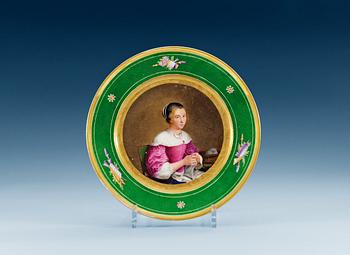 1371. A french plate with a portrait of a young lady, 19th Century.