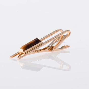 SLIPSNÅL, 14K guld, tigeröga. Elis Kauppi, Kupittaan kulta. Vikt ca 6,3 g.