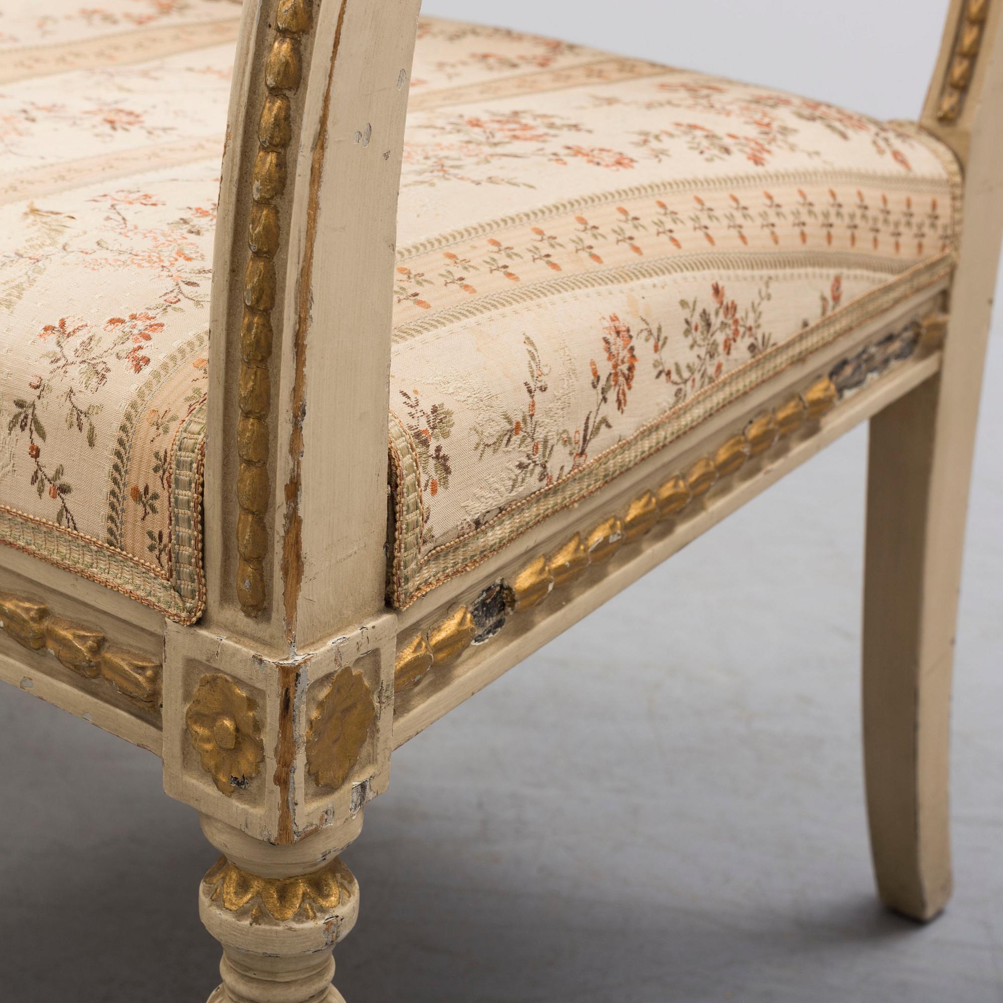 A pair of first half of the 19th century Empire arm chairs.