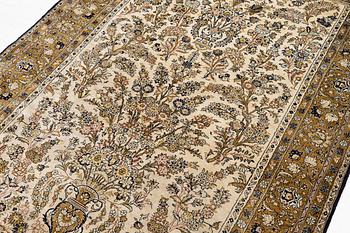 A Ghom, silk rug, c. 215 x 140 cm.
