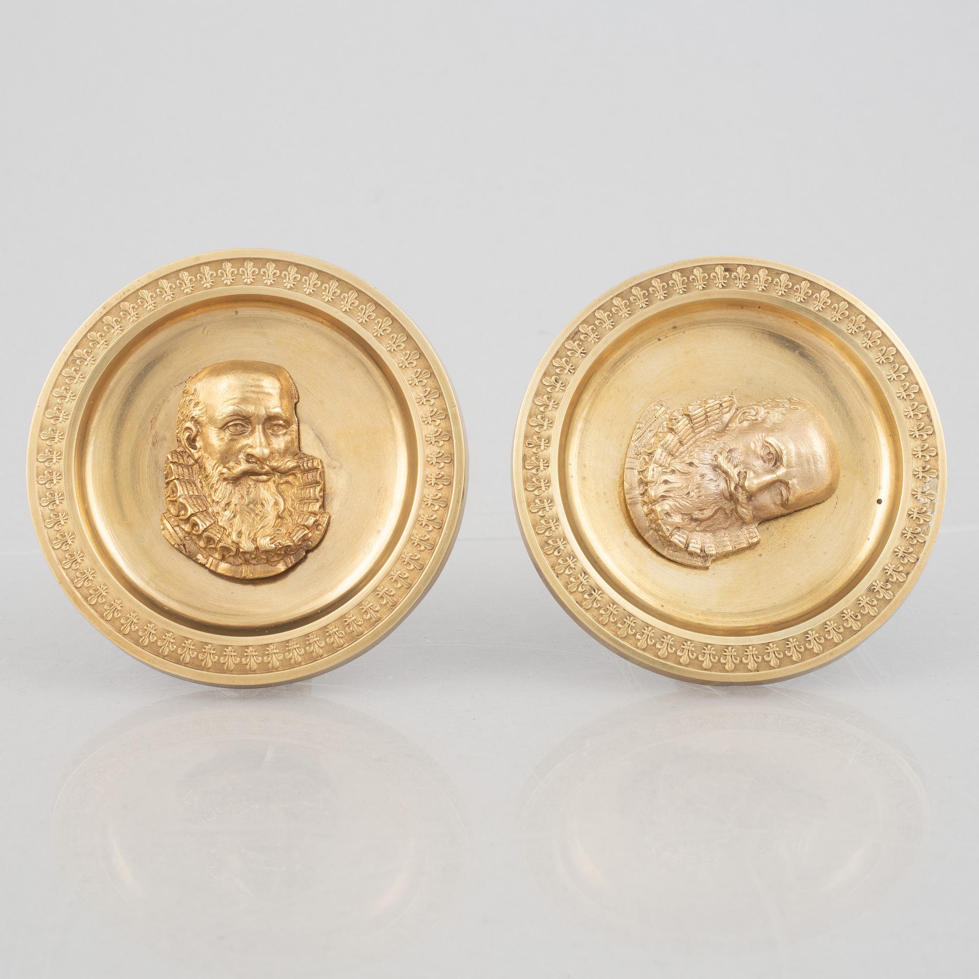 A pair of gilt-bronze Empire-style curtain holders, 19th century.