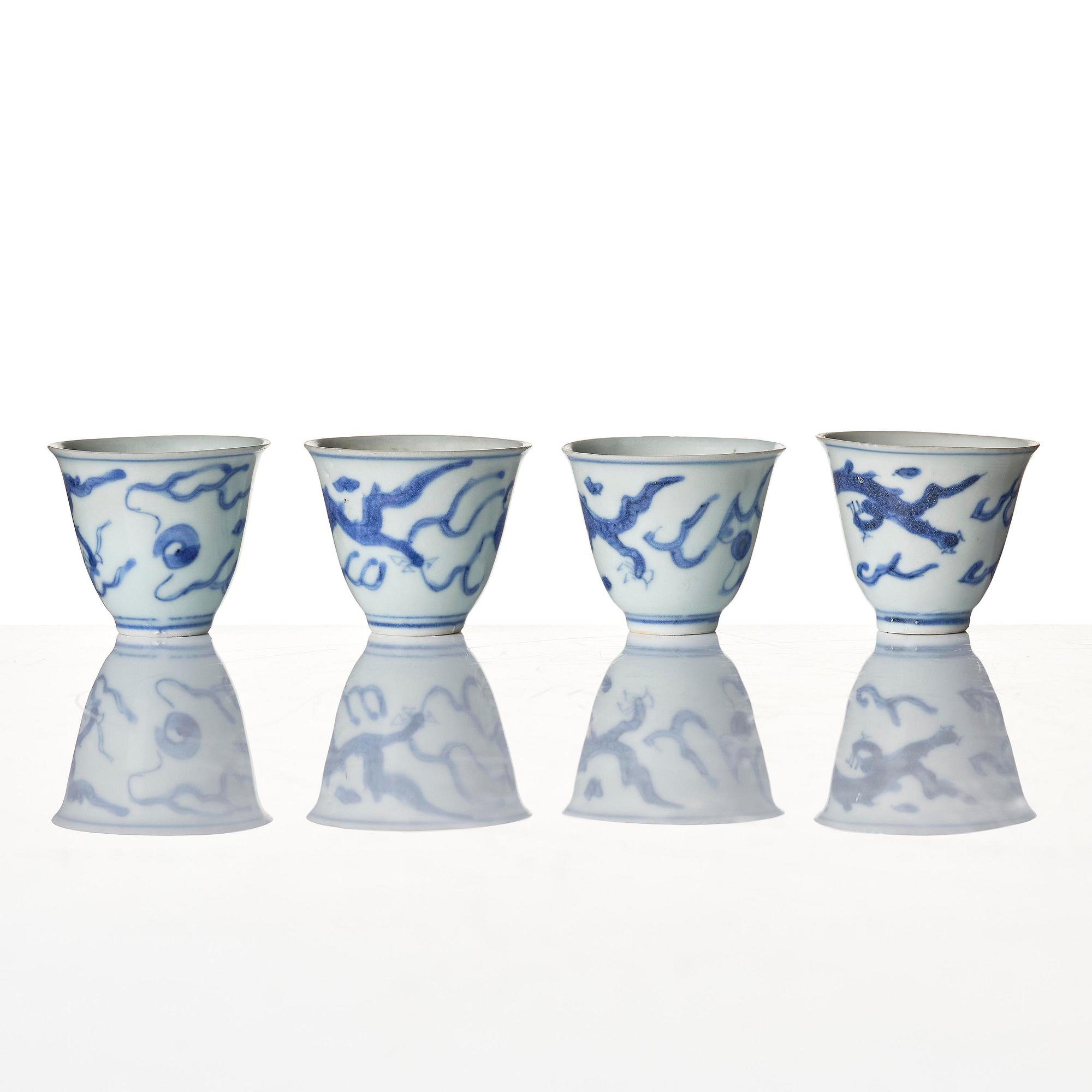 A set of four blue and white dragon wine cups, 'Hatcher Cargo', 17th century.
