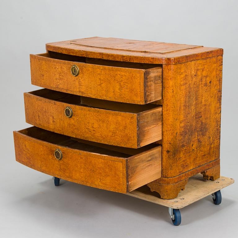 A bureau veneered in Karelian birch, mid-19th century.