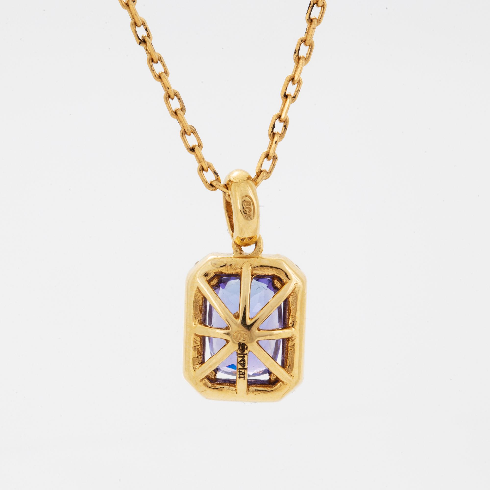 An 18K gold necklace set with a faceted tanzanite.