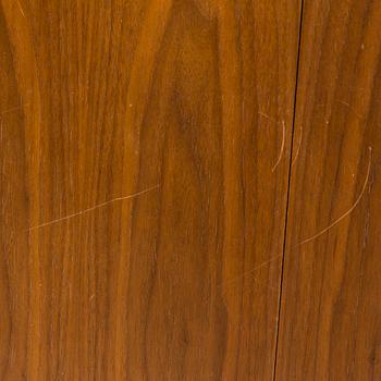 A 1960s teak and oak dining table.