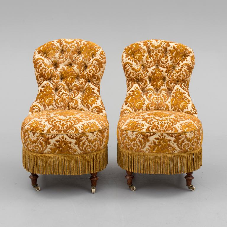 A pair of easy chairs, circa 1900.