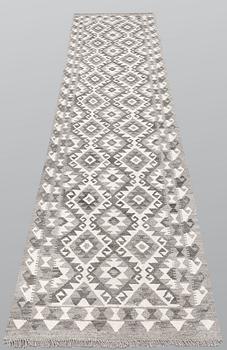 A runner, kilim, ca 298 x 84 cm.
