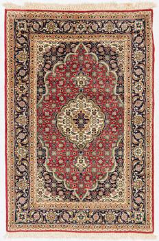 Rug, probably Tabriz, approx. 145 x 95 cm.
