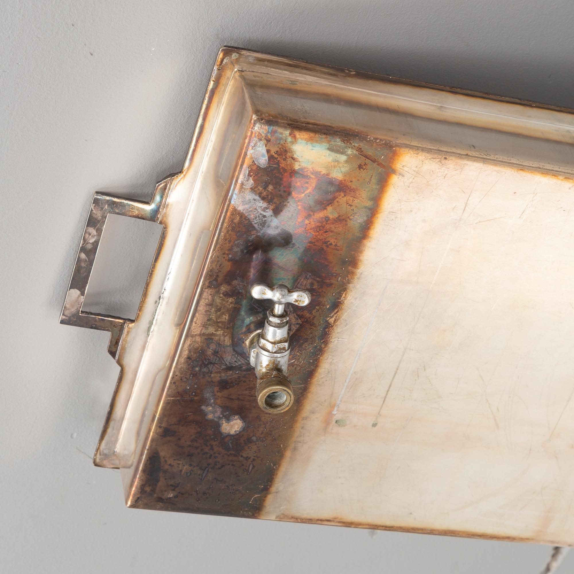 A restaurant serving trolley with silver plate dishes, first half of the/mid 20th century.
