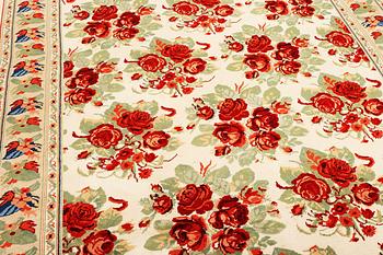 A carpet with a rose pattern, c. 310 x 196 cm.