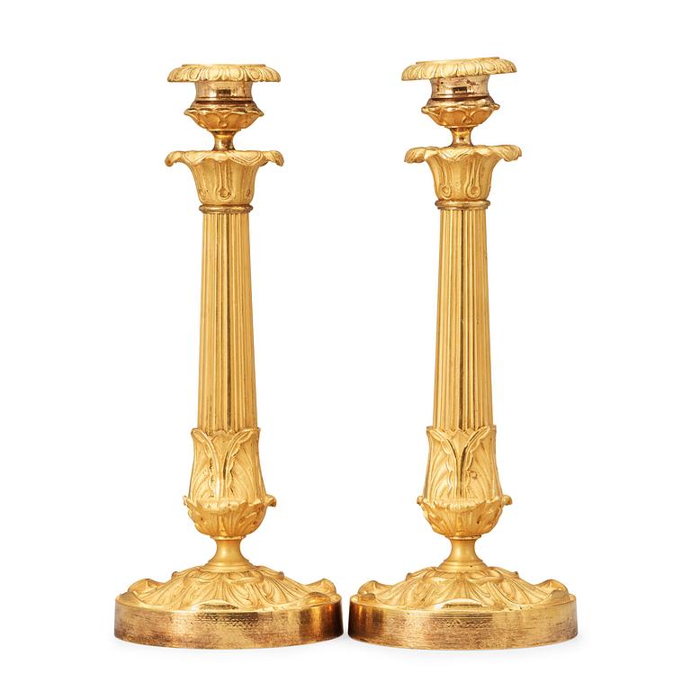 A pair of late Empire 19th century gilt bronze candlesticks.