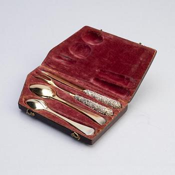 A possibly German 17/18th century parcel-gilt silver and filigree six-piece travel cutlery, unmarked, and leather case.