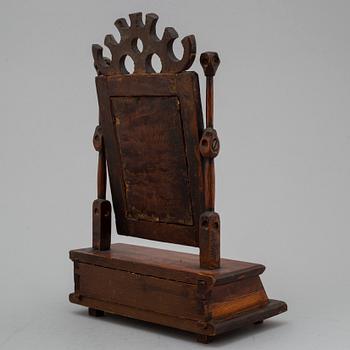 An early 19th century drawer with mirror.