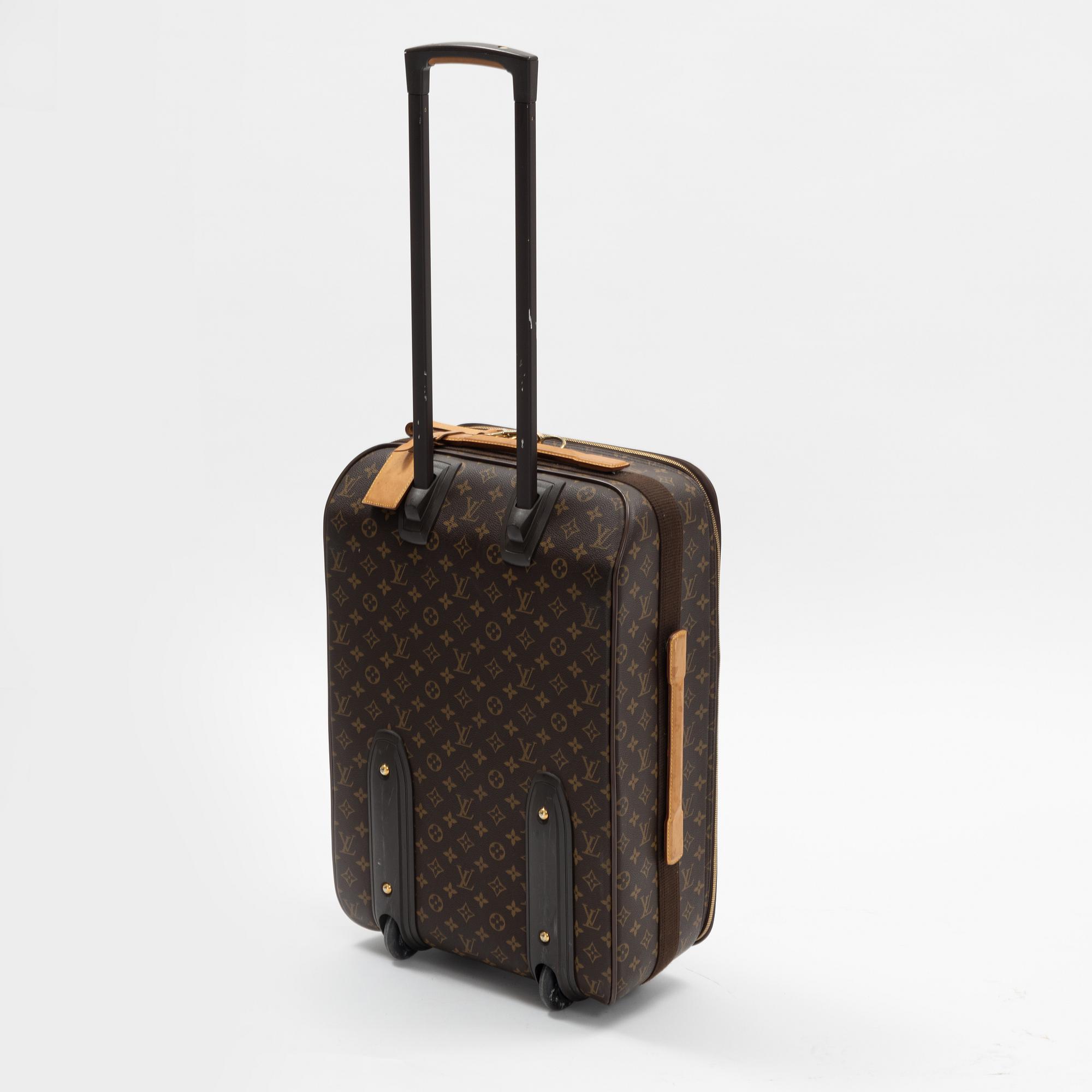A monogram printed leather "Pegase 45" cabin bag by Louis Vuitton.