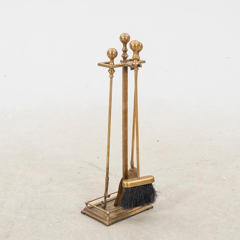 A sete of three brass fireirons and stand, first half of the 20th Century.