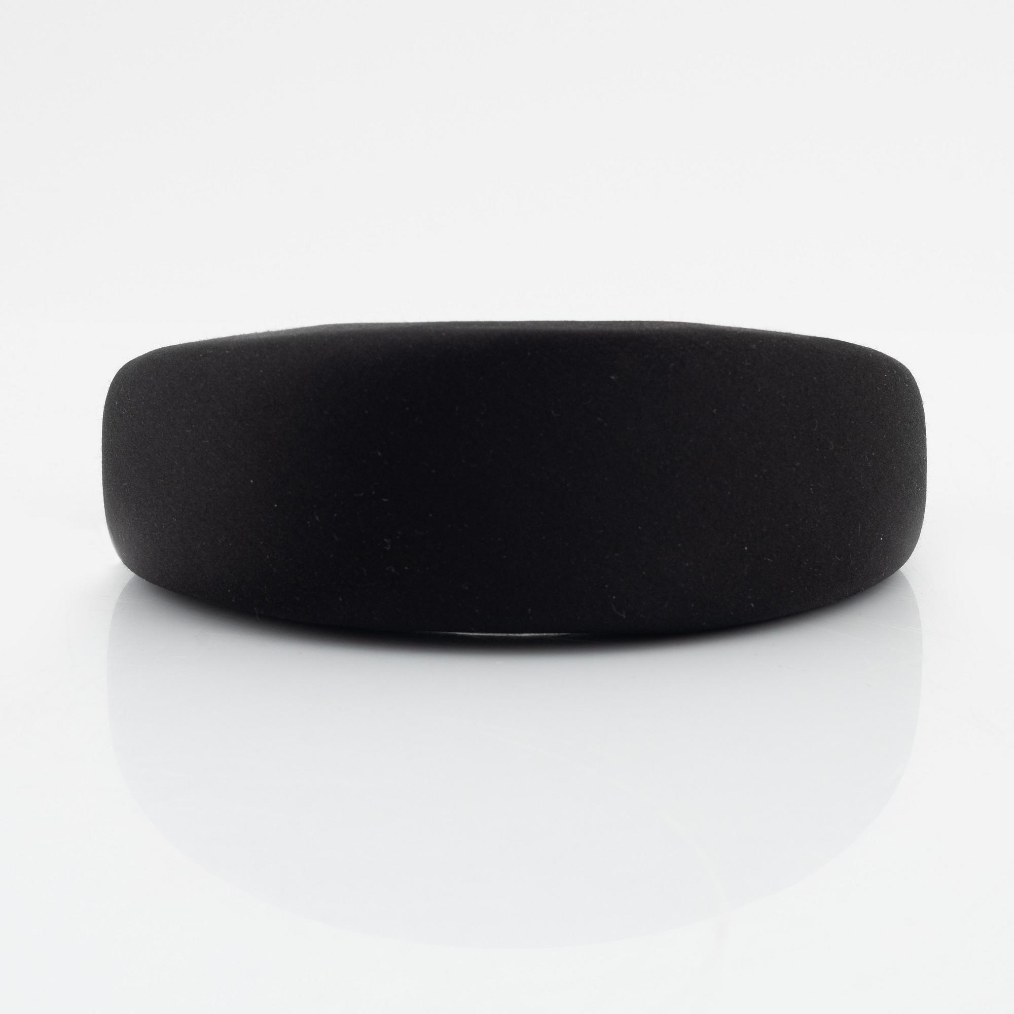 Prada, a black silk hair accessory.