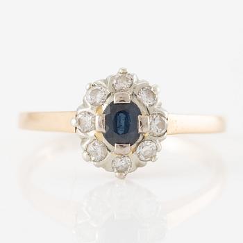Ring, 18K gold with a small sapphire and brilliant-cut diamonds.