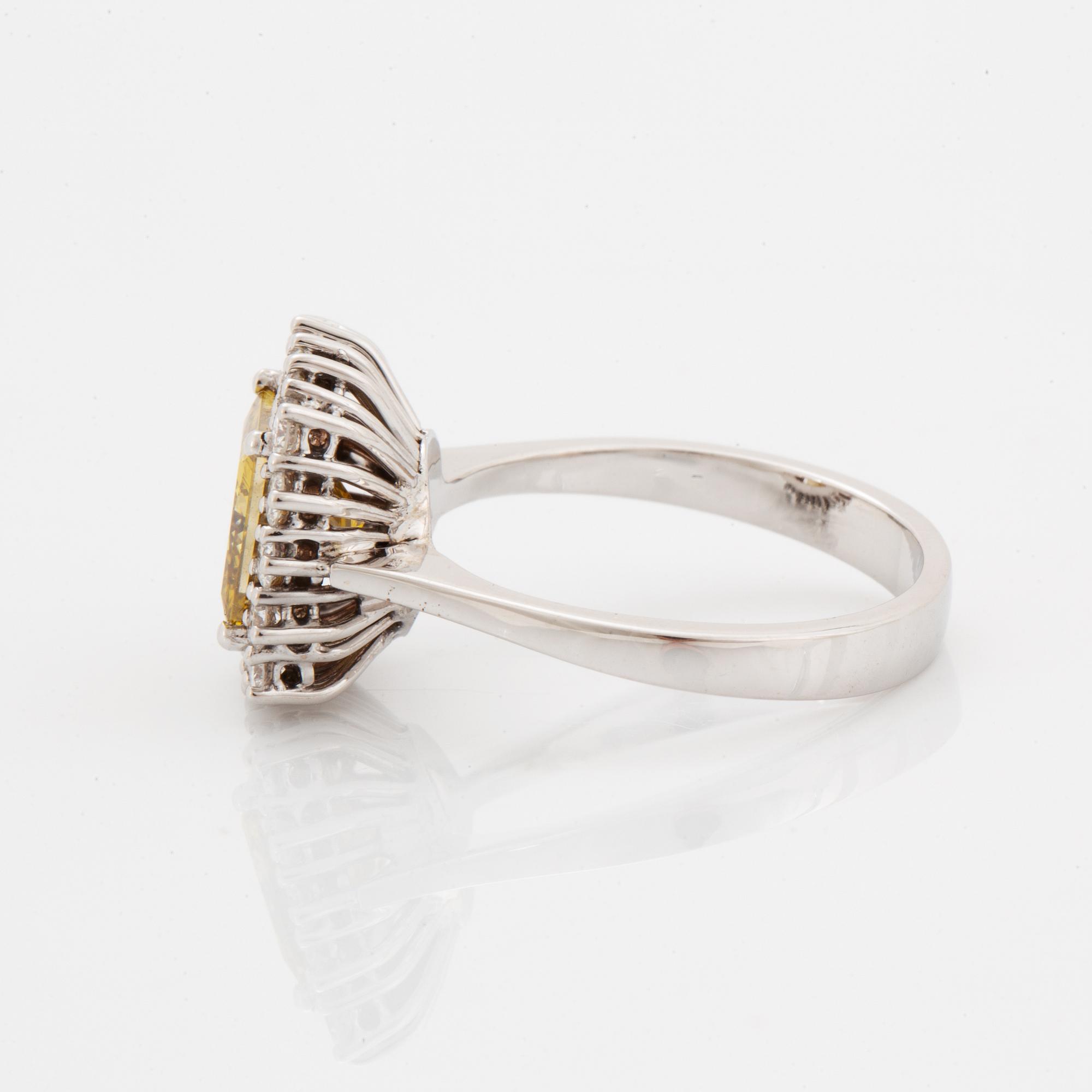 Princess-cut colour treated fancy deep brown-yellow diamond ring.