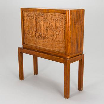 Margaret T. Nordman, kaappi, / Hanne Autere reliefi, Oy Stockmann Ab, Keravan Puusepäntehdas, 1930-luku.