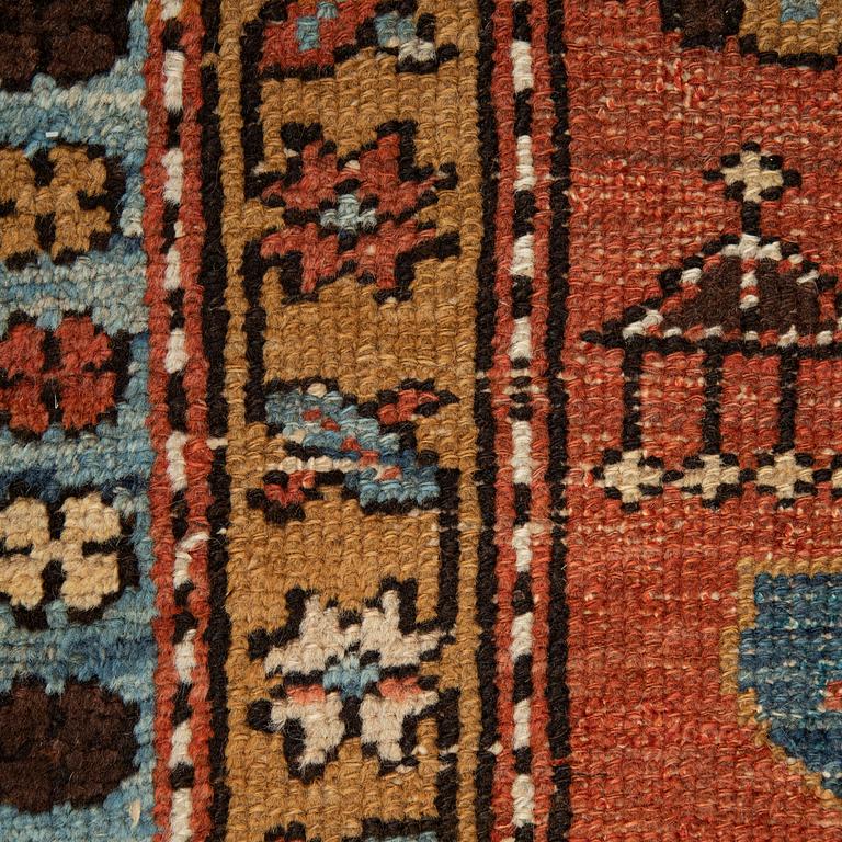 A Heriz runner, ca 310 x 85 cm.
